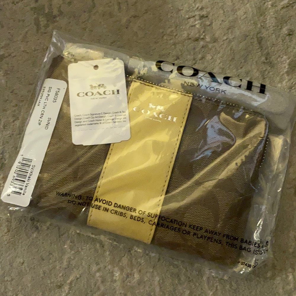 NEW in plastic authentic Coach wristlet